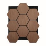 Wooden hexagonal tiles forming a honeycomb mosaic on a black backing board with visible wood grain and dark grout lines behind each tile, center-focused composition.